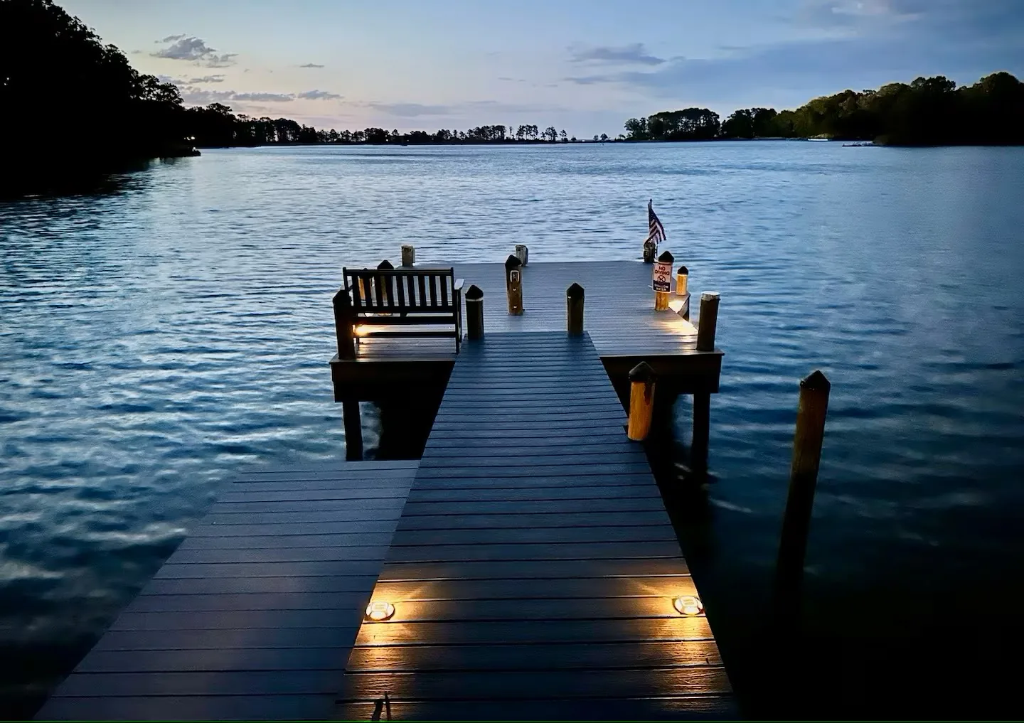 Private dock at Vista Cove illuminated after sunset