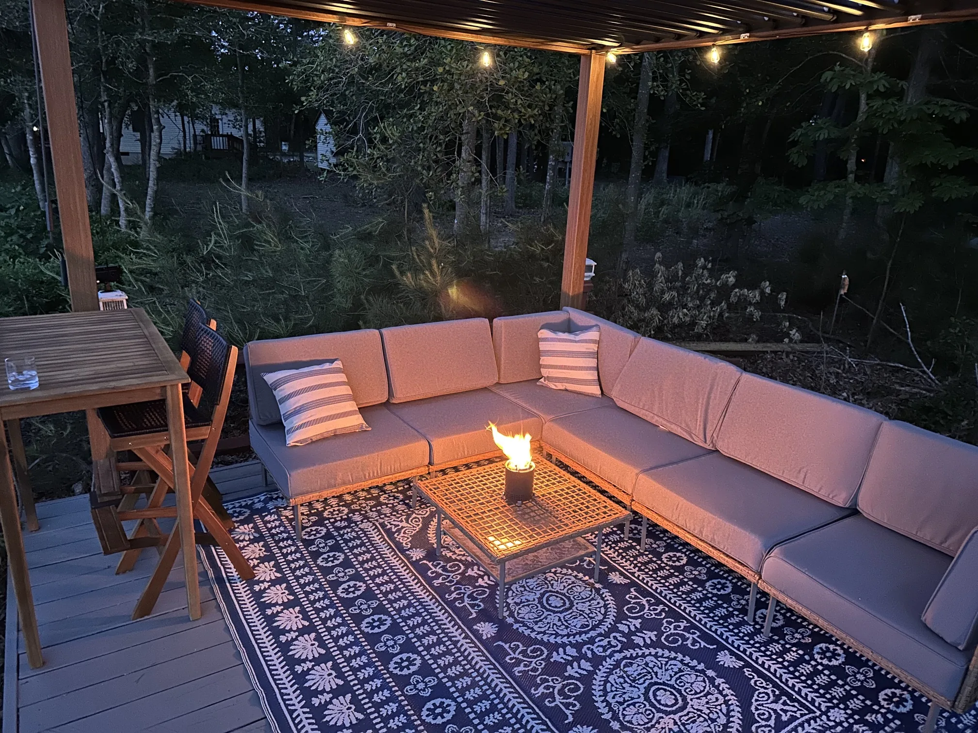 Pergola lounge at night with candlelight